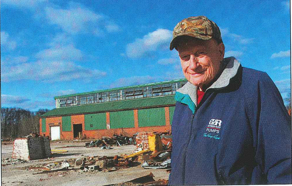 Lloyd Hull, a 31-year employee at PPG standing in front of the Carpenter Shop in 2013. Hull spent most of his time in the Carpenter Shop, helping to repair anything in the factory made of wood. Courtesy of Aaron Keirns